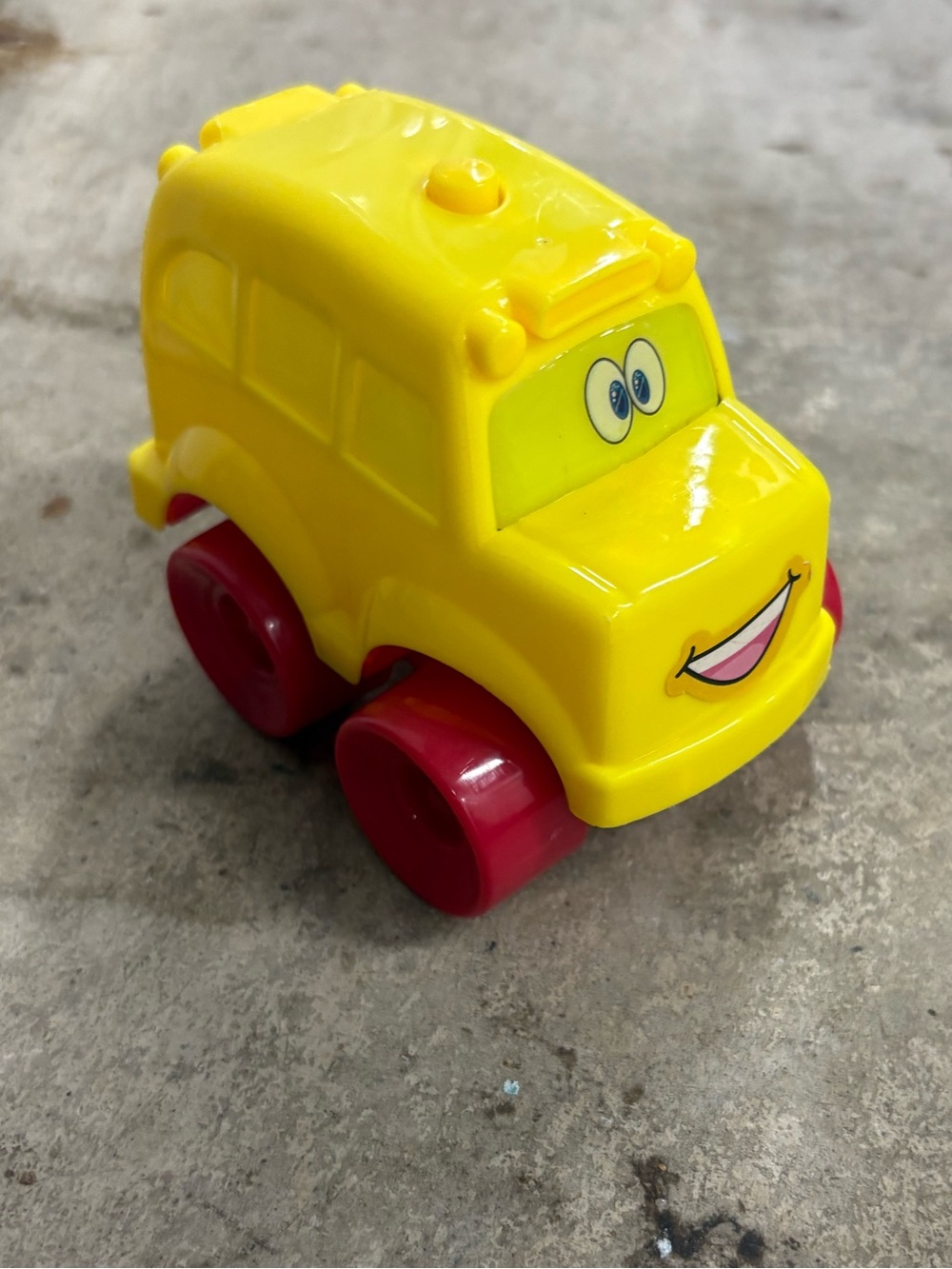 Yellow Cartoon School Bus Toy Vehicle w/ Red Wheels, Plastic w/ Cartoon Face